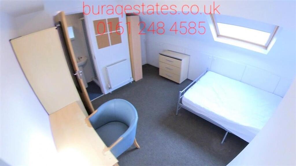Bright and tidy single bedroom featuring a skyl...