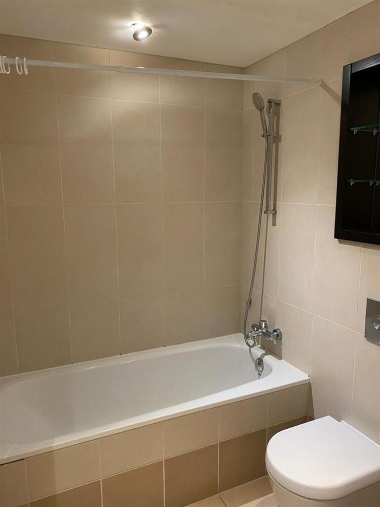 A clean and modern bathroom featuring a full-si...