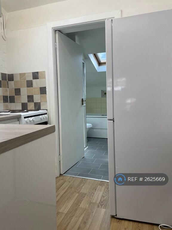 Kitchen Leading To Bathroom