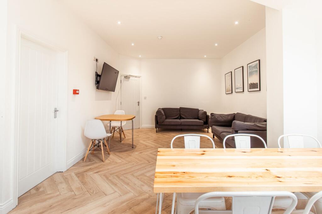 Bright, well-maintained living room with modern...