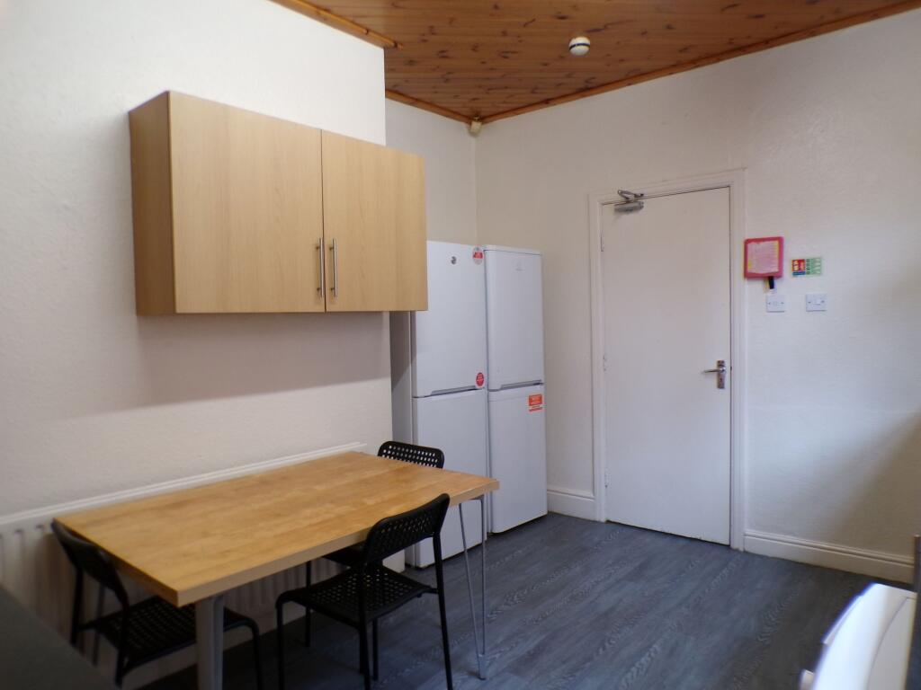 A straightforward kitchen area featuring a smal...