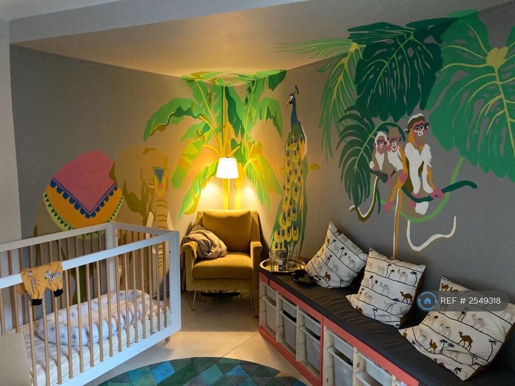 Nursery Room With Animal Mural