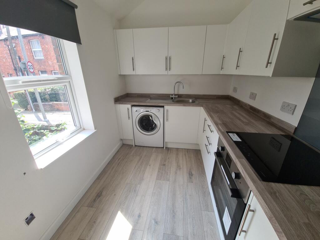 A bright and modern kitchen with ample workspac...