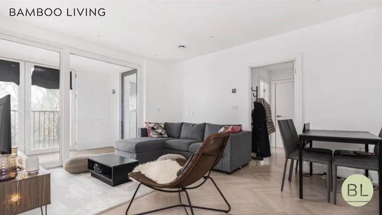 A modern and stylish living room featuring a co...