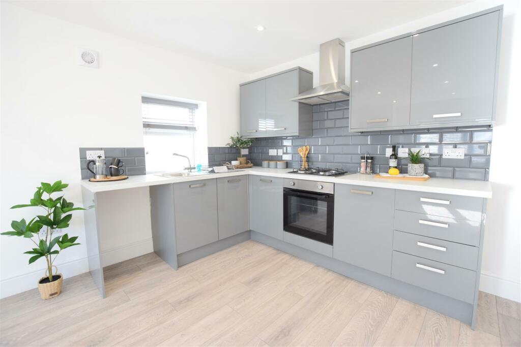 Apt 7 Living Kitchen.JPG