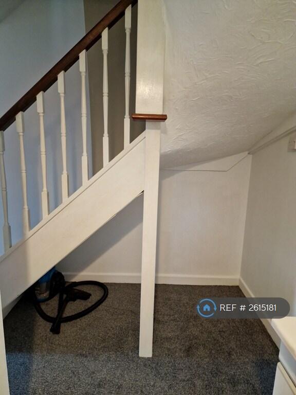 Under Stairs Storage View From Kitchen
