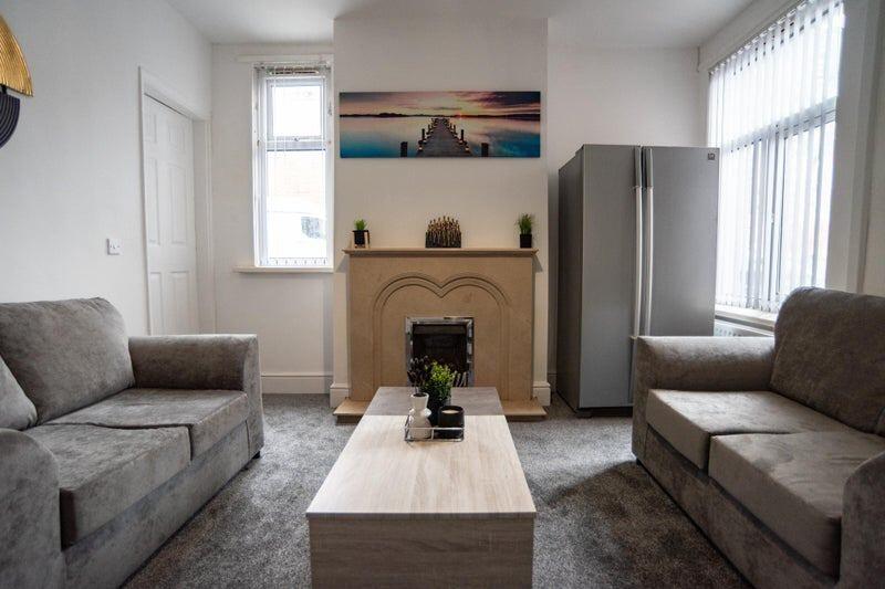 A modern and inviting living room featuring two...