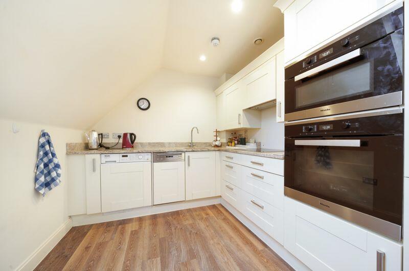 Kitchen with built-in appliances