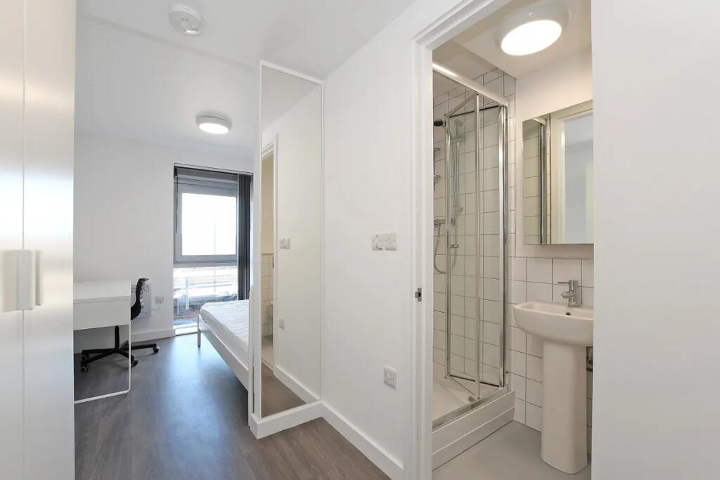 A bright and modern double bedroom featuring a ...