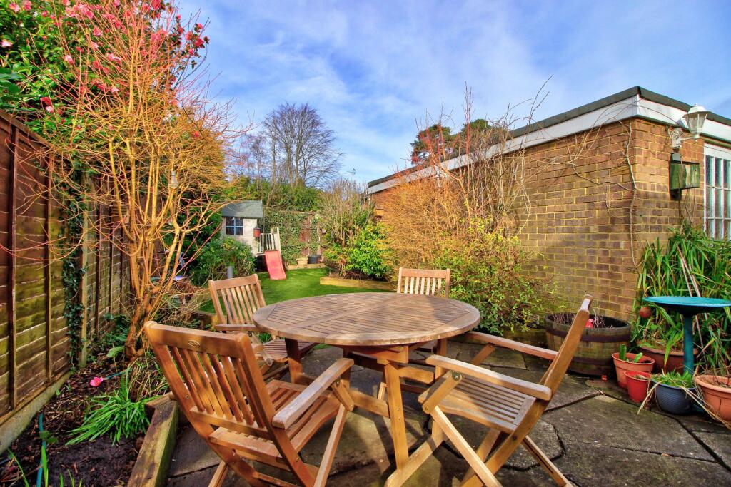Patio showing rear of detached garage