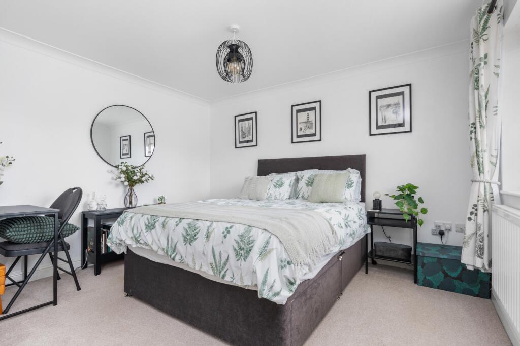 This spacious room easily fits the kingsize bed