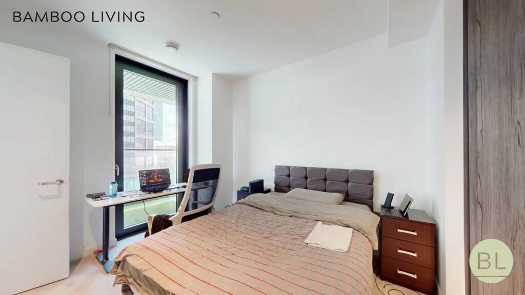 A modern double bedroom featuring a comfortable...