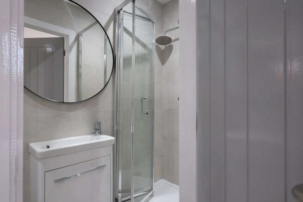 Modern and stylish bathroom featuring a sleek s...