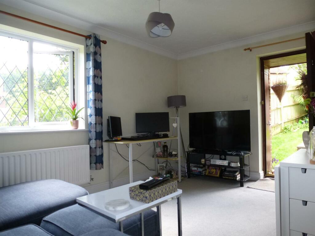 Sitting room with carpetn 2nd angle.JPG