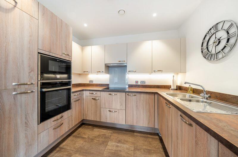 Kitchen with built-in appliances