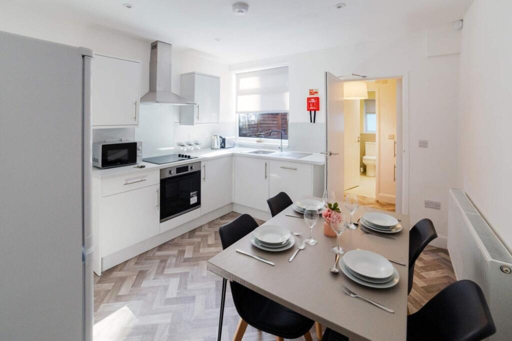 This contemporary kitchen features modern appli...