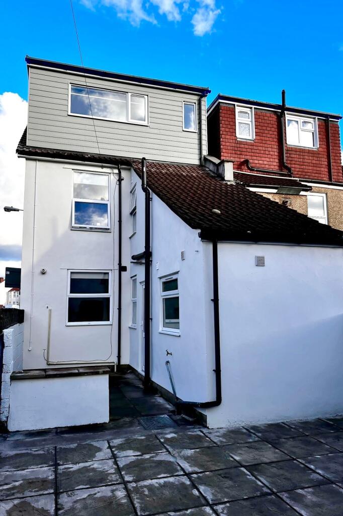 Bright and well-maintained exterior of a terrac...