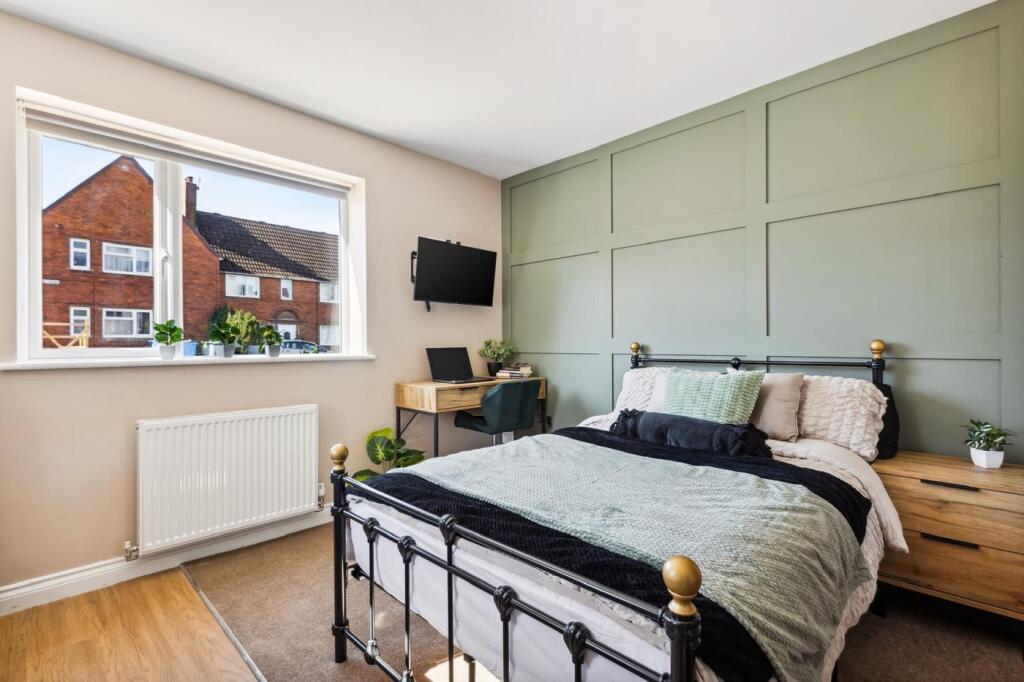 A beautifully designed double bedroom featuring...