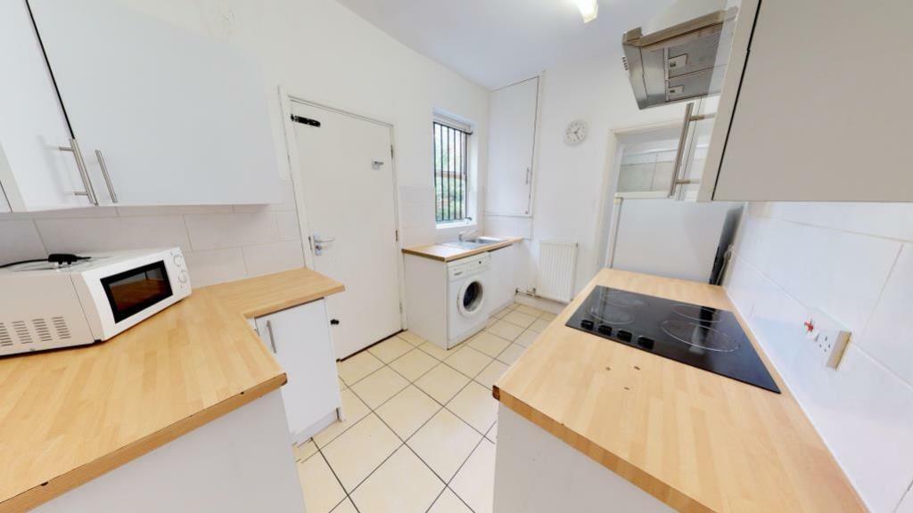 Bright and clean kitchen featuring modern appli...