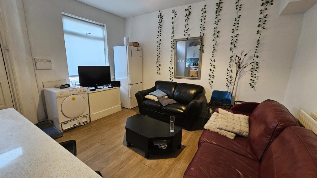 A cozy living room featuring a comfortable sofa...