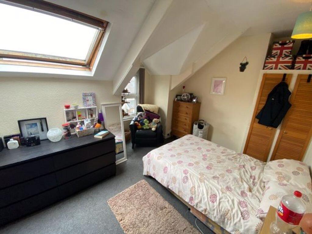 Bright and cozy master bedroom featuring a doub...