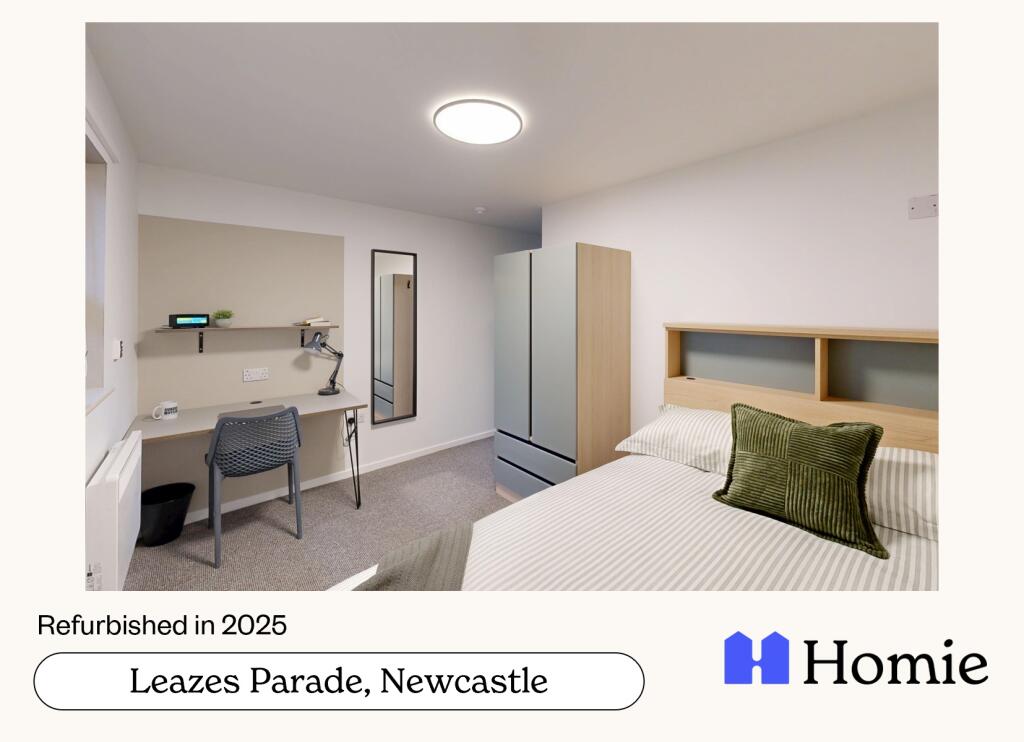 A bright and clean bedroom featuring a comforta...