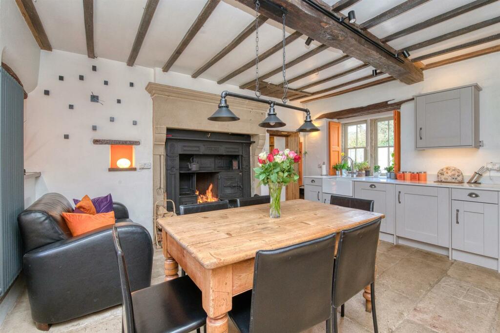 Dining Room - table, stove and shuttered window.jp