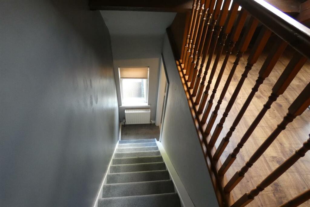 A FURTHER FIXED STAIRCASE LEADS TO:-