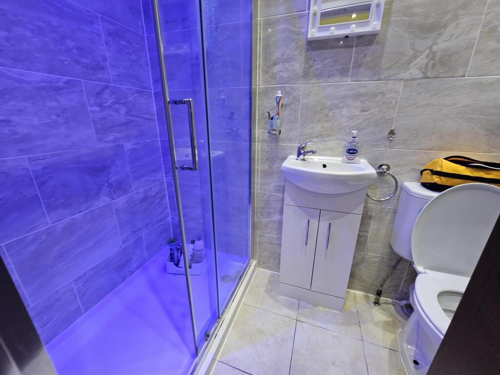 Modern bathroom with a spacious shower enclosur...