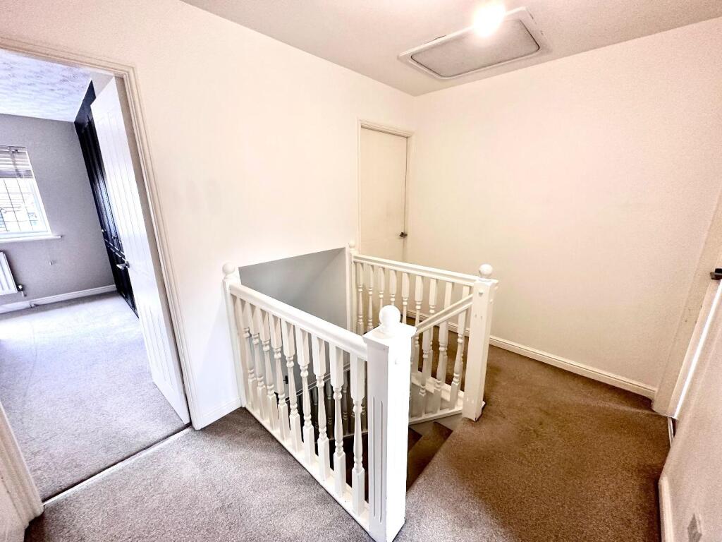 STAIRCASE RISES TO FIRST FLOOR