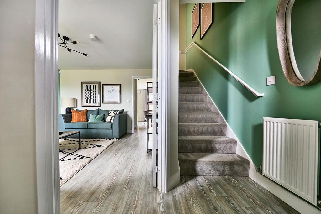 The entrance hall leads through to the light and airy living room