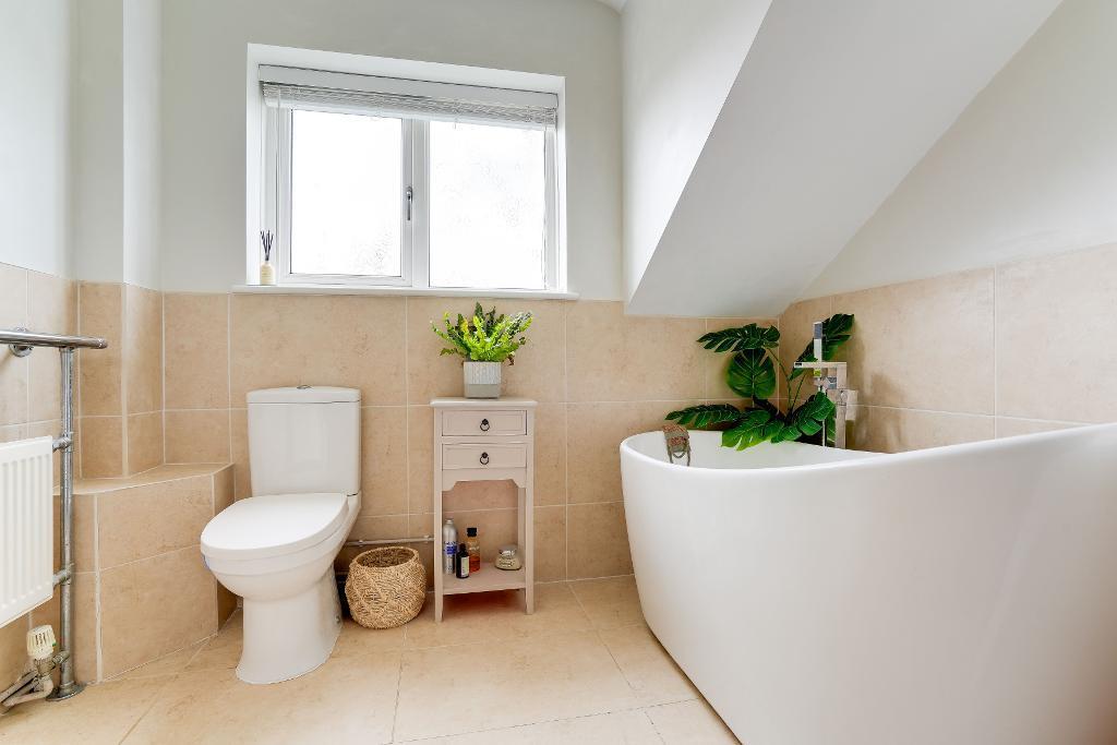 En suite bathroom to bedroom 1