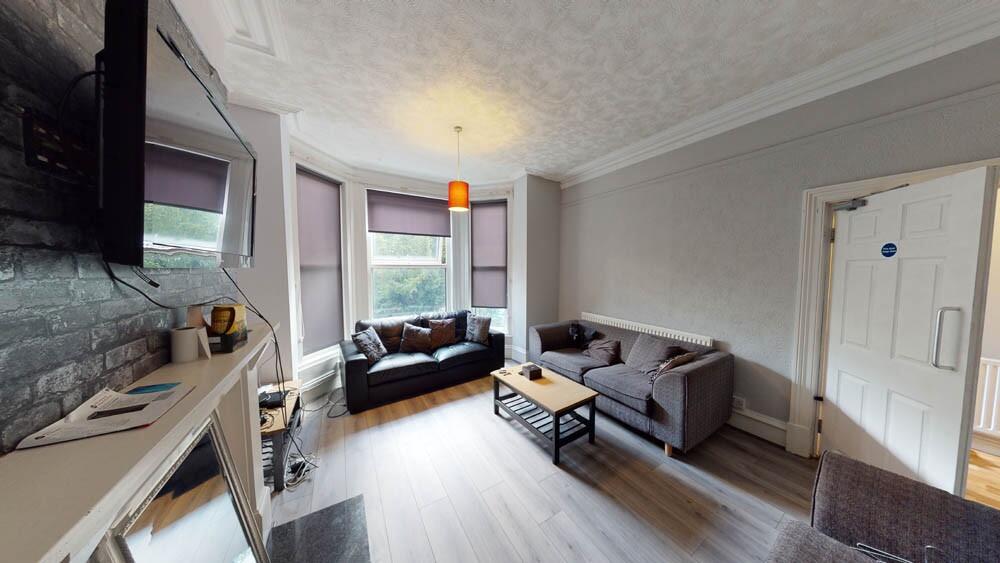 A contemporary living room with a comfortable s...