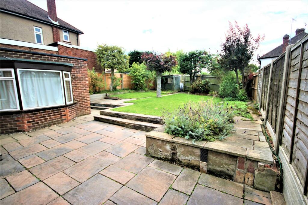 REAR GARDEN &amp; PAVED PATIO AREA: