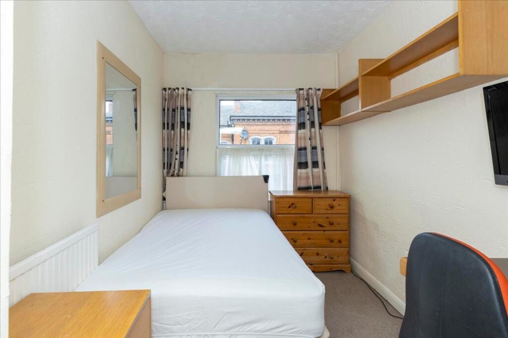 This charming double bedroom offers a cozy atmo...