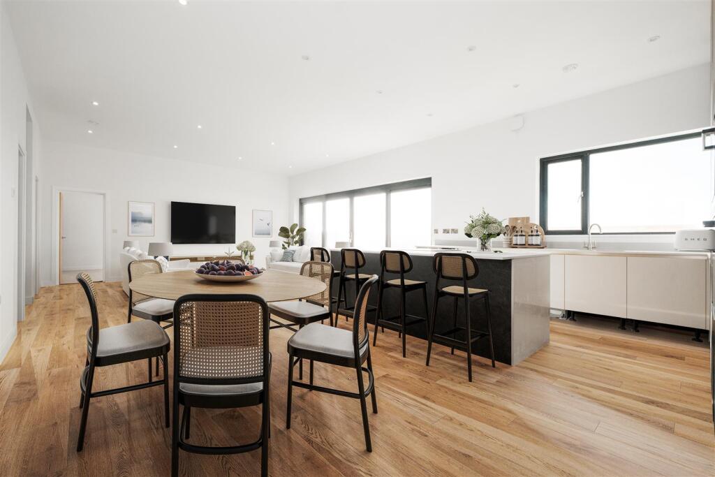 4 - tv - sofa and wall pictures and oak flooring (