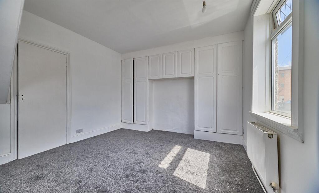 BEDROOM ONE TO FRONT