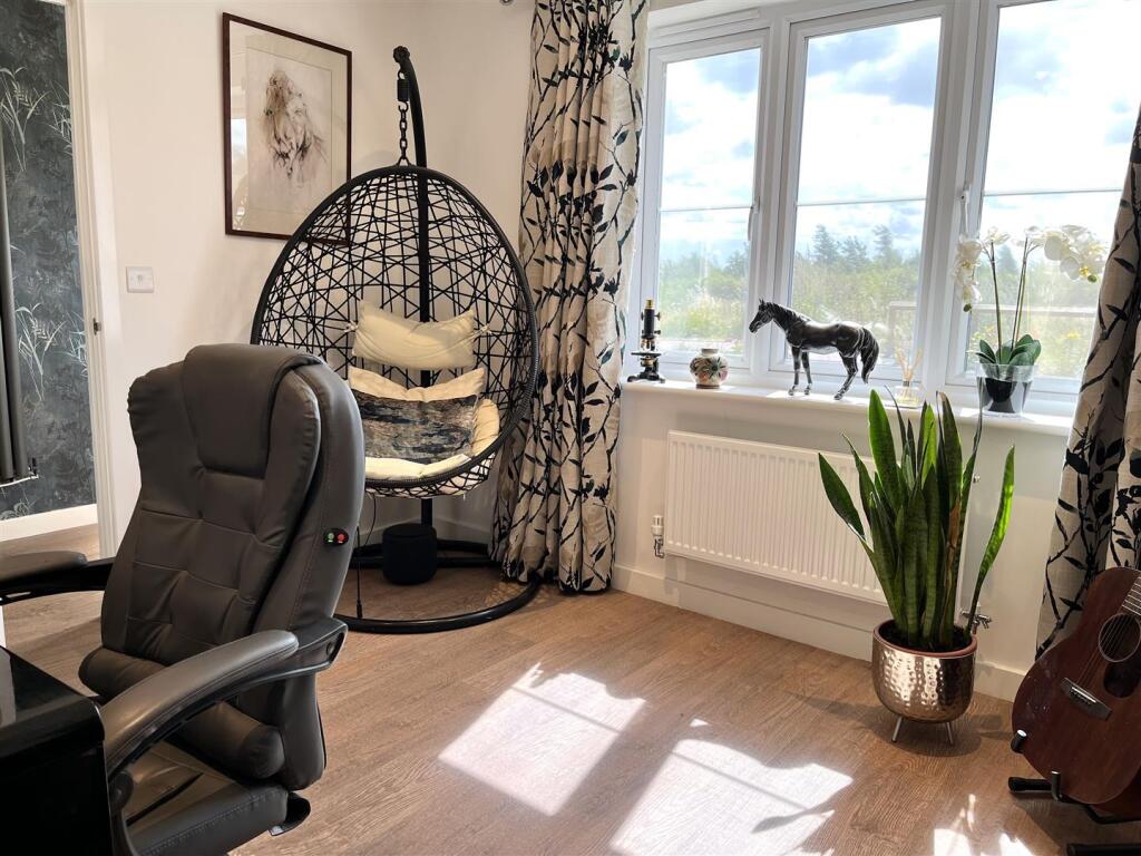 HOME OFFICE/PLAYROOM (FRONT)