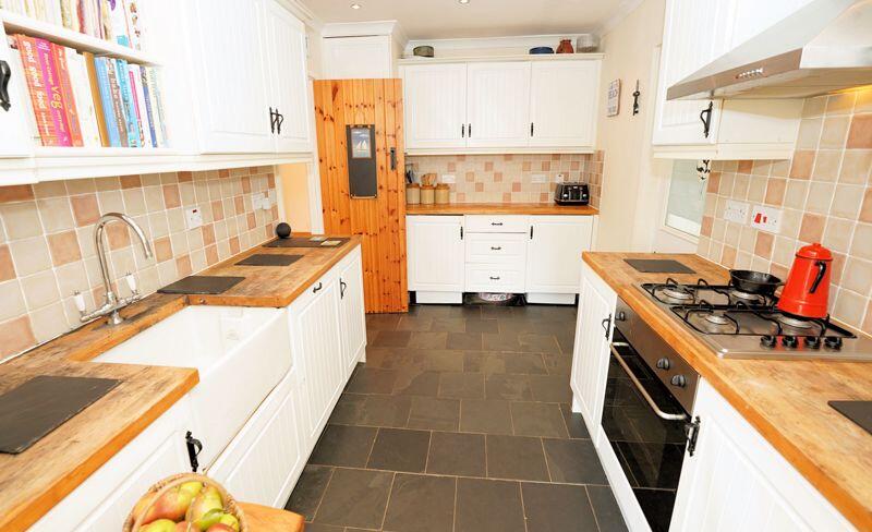 Kitchen with built in oven and hob