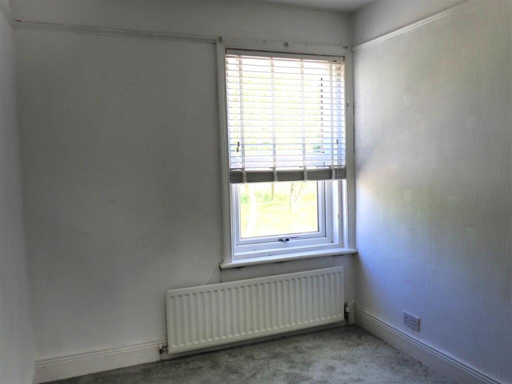 THIRD FRONT BEDROOM