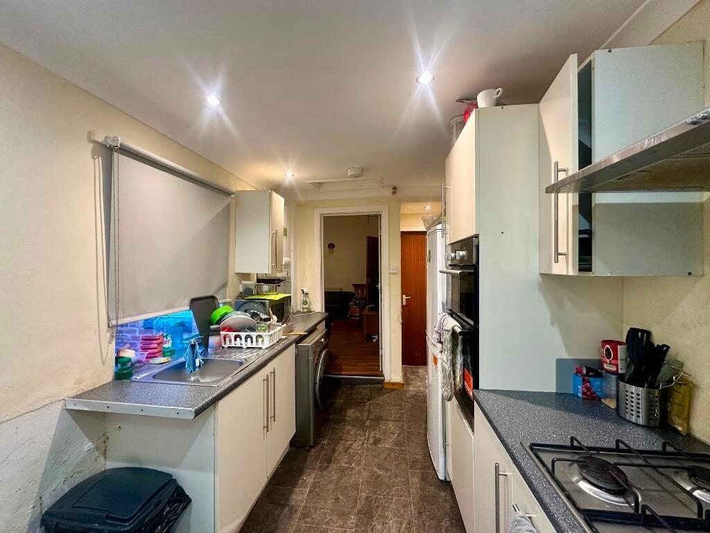 A tidy and functional galley kitchen with moder...