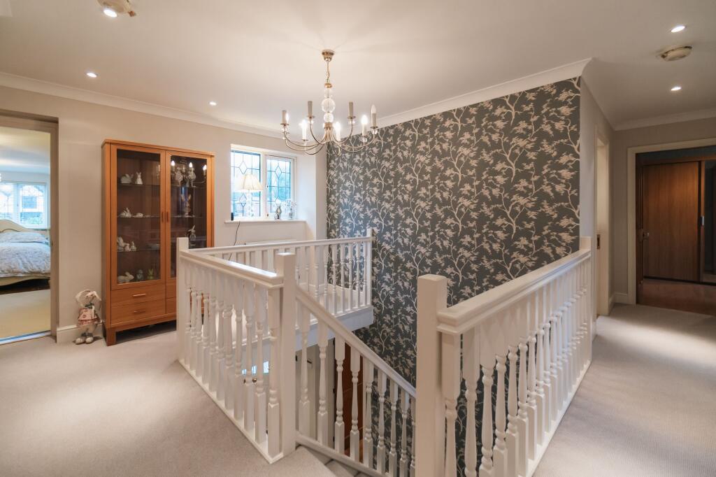 Winding staircase and gallieried landing