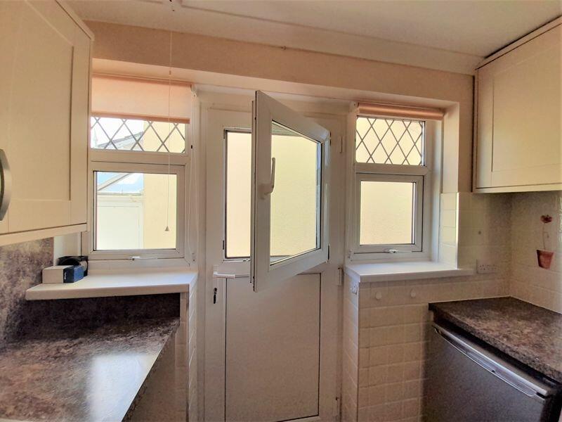 Door incorporating tilt-n-turn window
