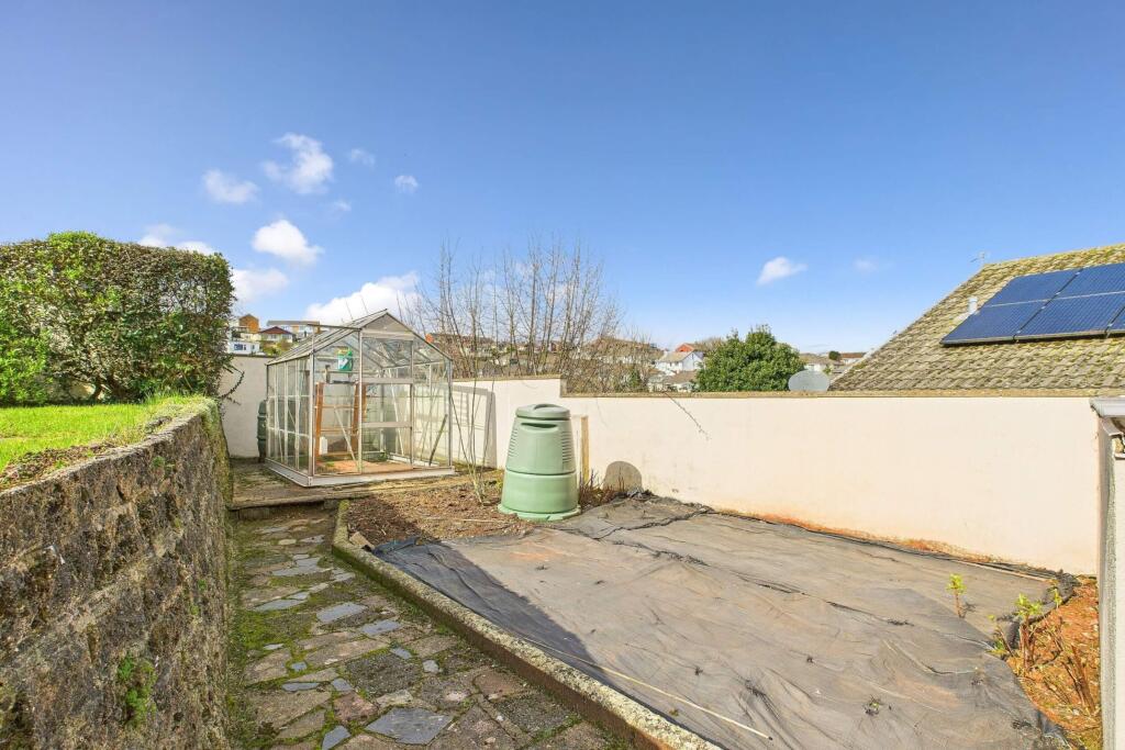 Rear garden with greenhouse &amp; planting area