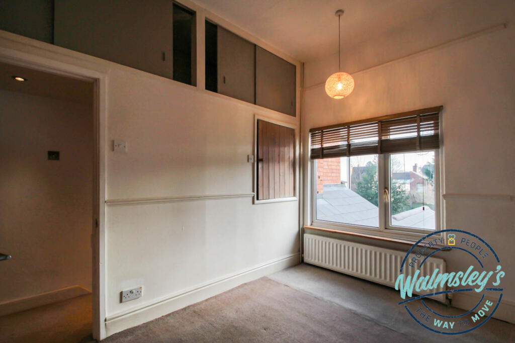 Rear bedroom with storage