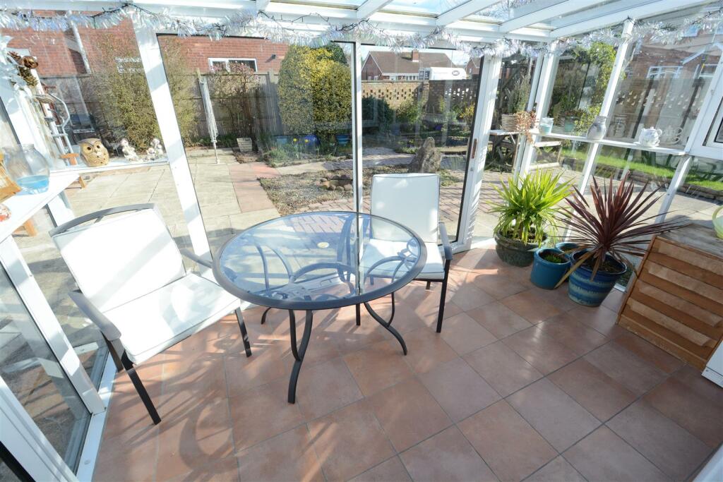 Rear sun room (off kitchen)