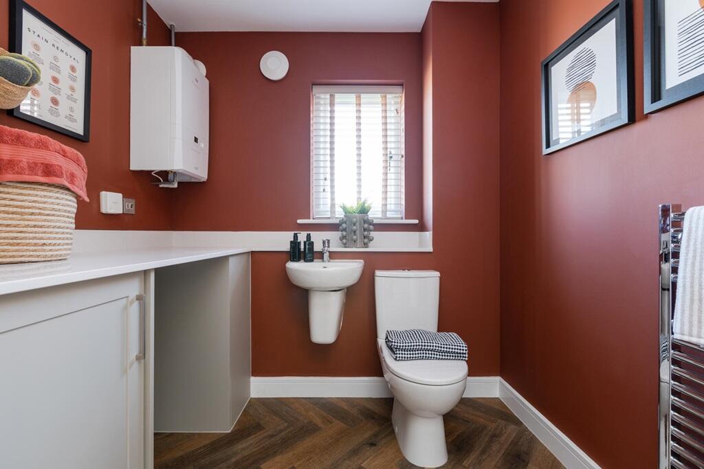 A downstairs cloakroom and utility adds convenience