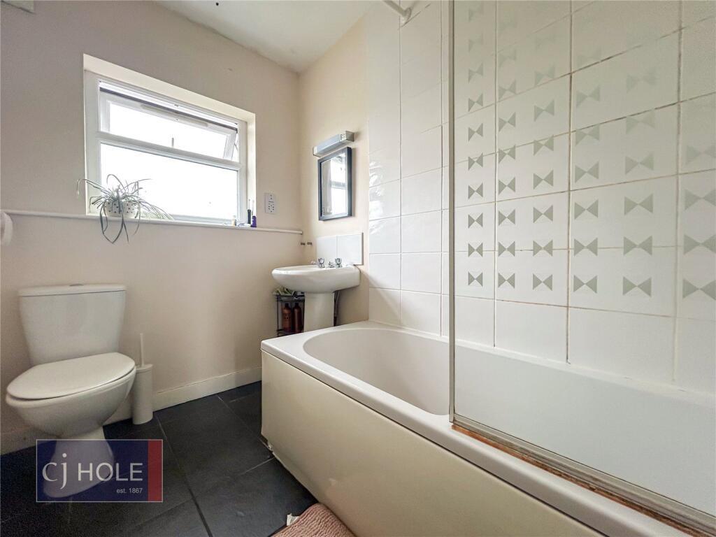 Bright and clean bathroom featuring a full bath...