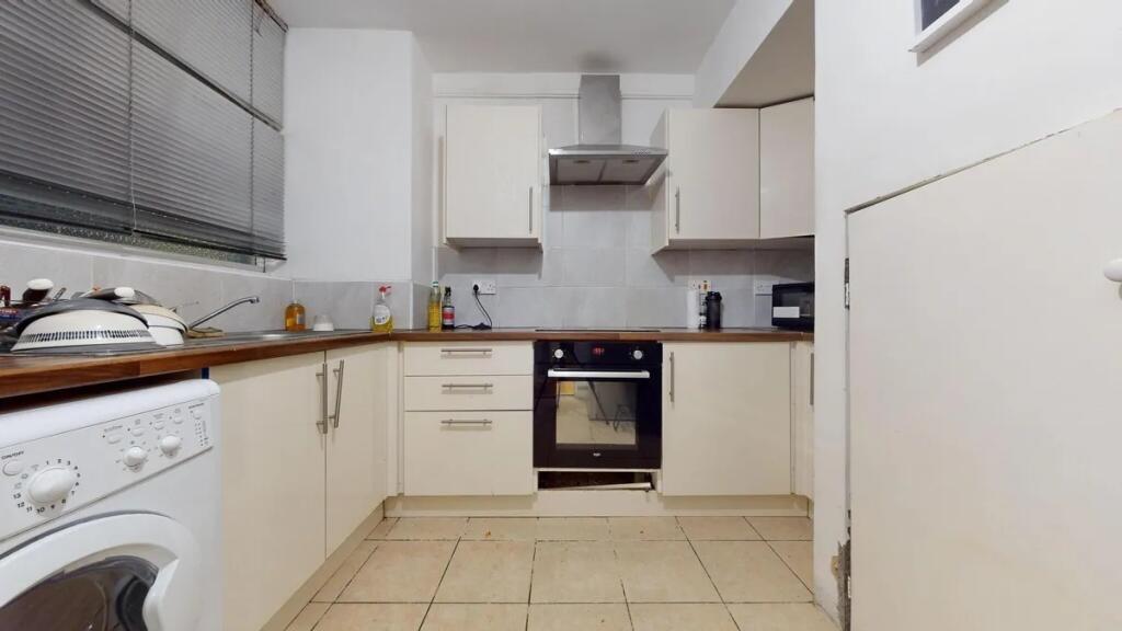 A functional kitchen featuring modern appliance...