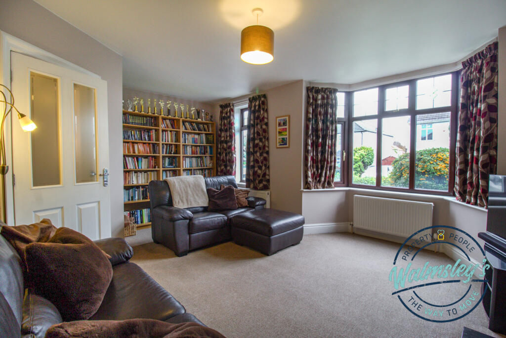 Sitting room with bay &amp; door to hallway